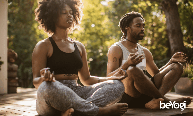 Two yogis meditate as they ponder the history of yoga, an ancient practice.